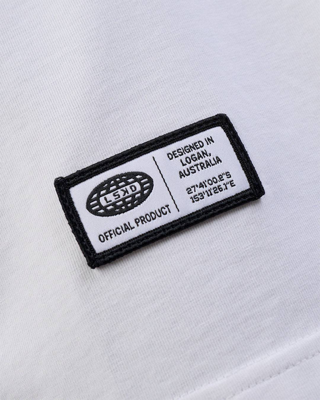 Man wearing Grid FLXCotton Oversized Tee - White-Black | Model:Zoran | Size:L