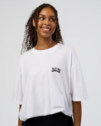 Woman wearing Grid FLXCotton Oversized Tee - White-Black | Model:Jordan | Size:L