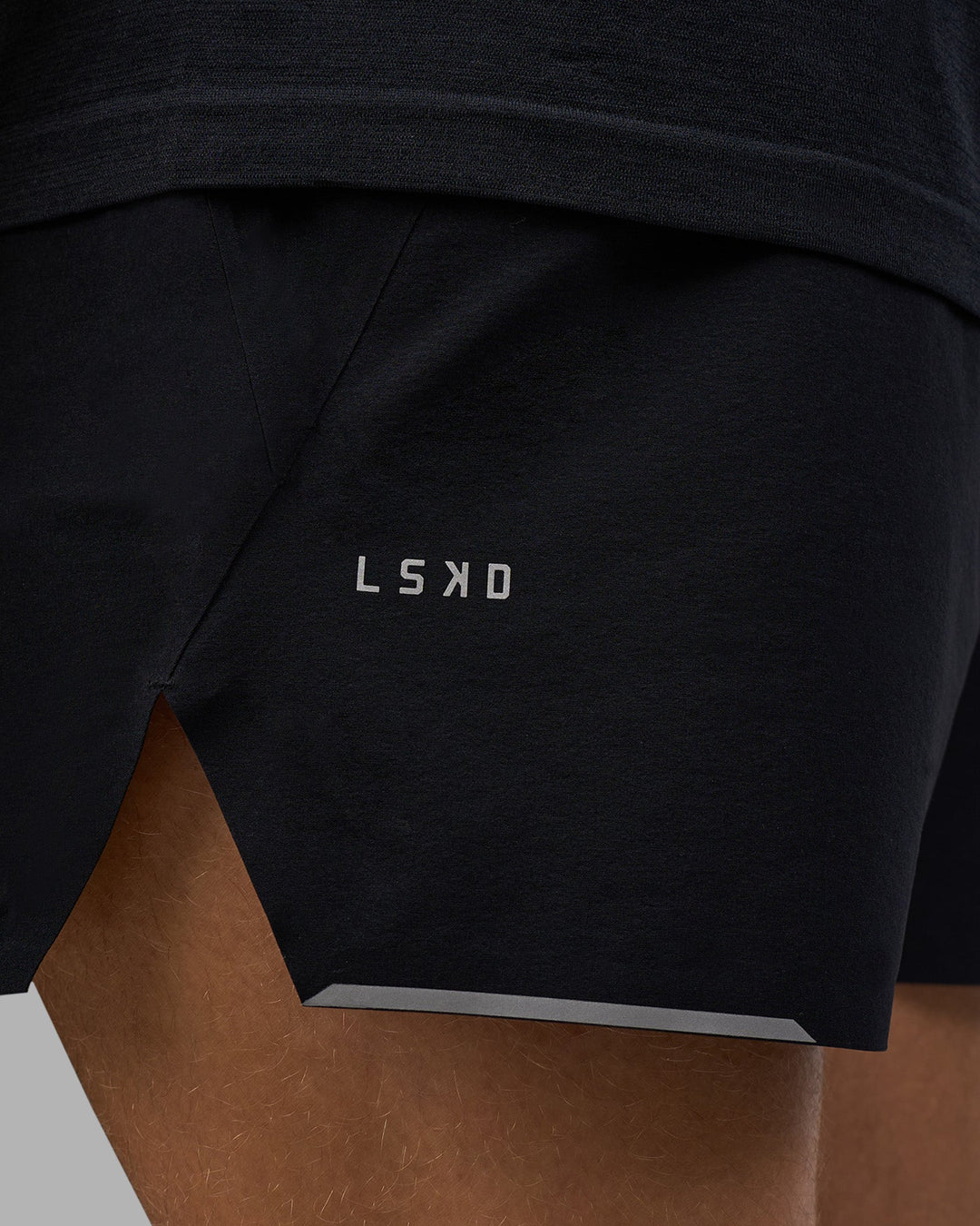 Man wearing Hybrid Lined 5&quot; Short - Black-Reflective | Model:Nikola | Size:L
