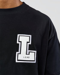 Man wearing Hype Heavyweight Unisex Oversized Tee - Black-White | Model:Xavier | Size:L