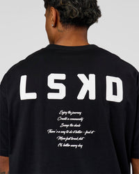 Man wearing Hype Heavyweight Unisex Oversized Tee - Black-White | Model:Xavier | Size:L