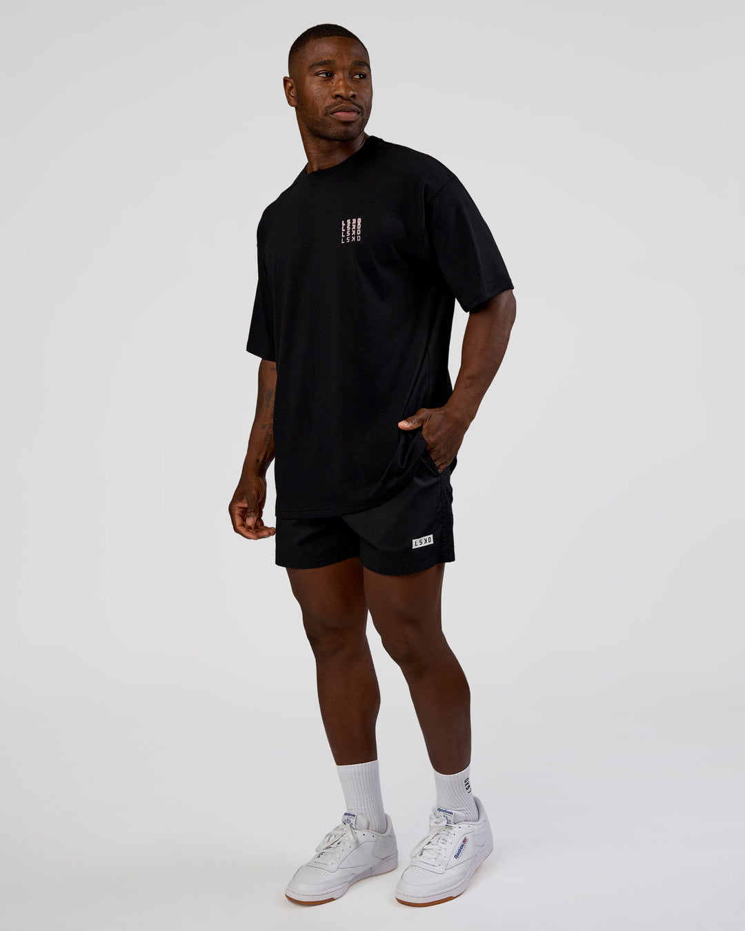 Man wearing Inferno Journey FLXCotton Oversized Tee - Black-Ultra Fuchsia | Model:Sam | Size:L