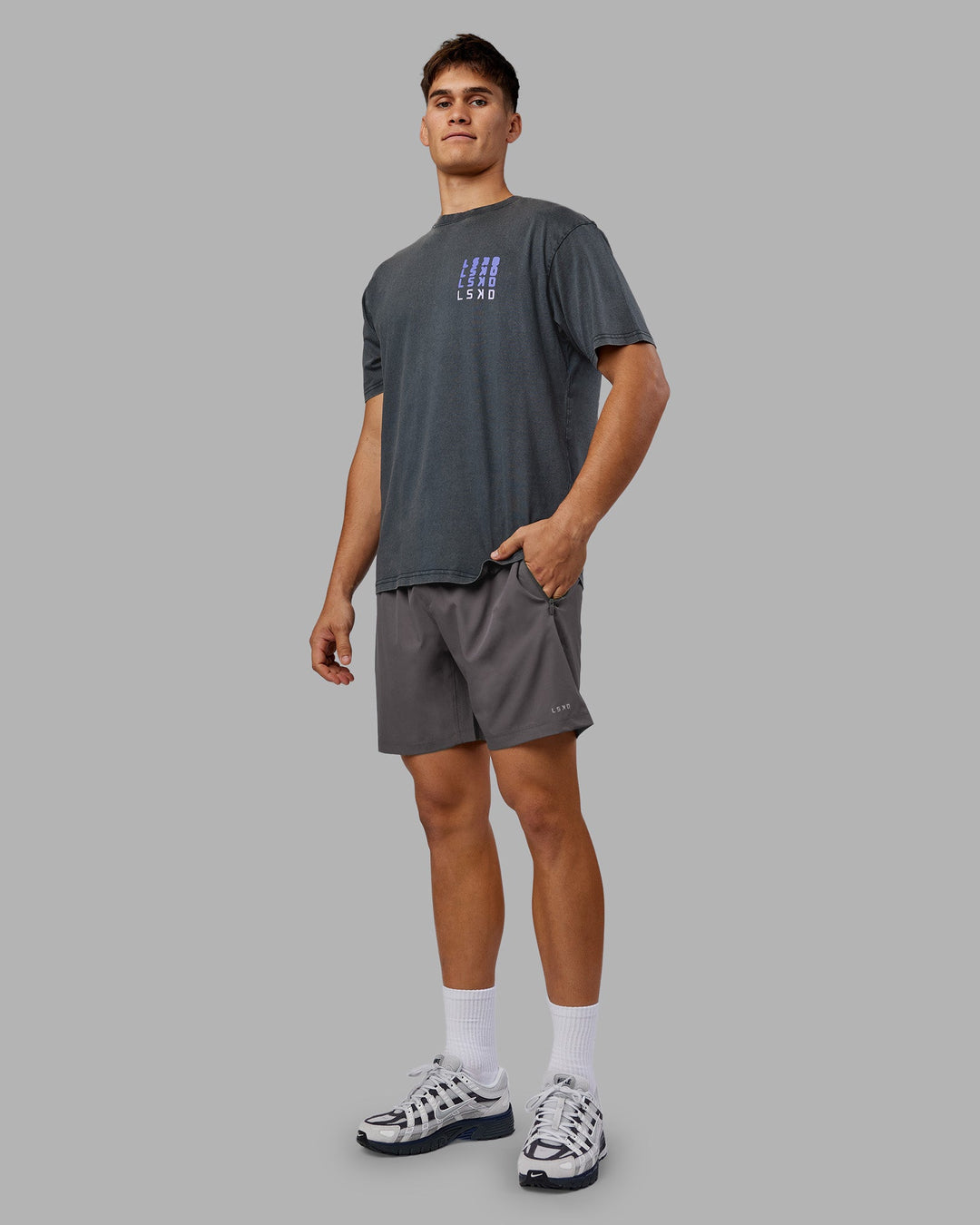 Man wearing Inferno Journey FLXCotton Oversized Tee - Black Washed-Violet Ray | Model:Jackson | Size:L