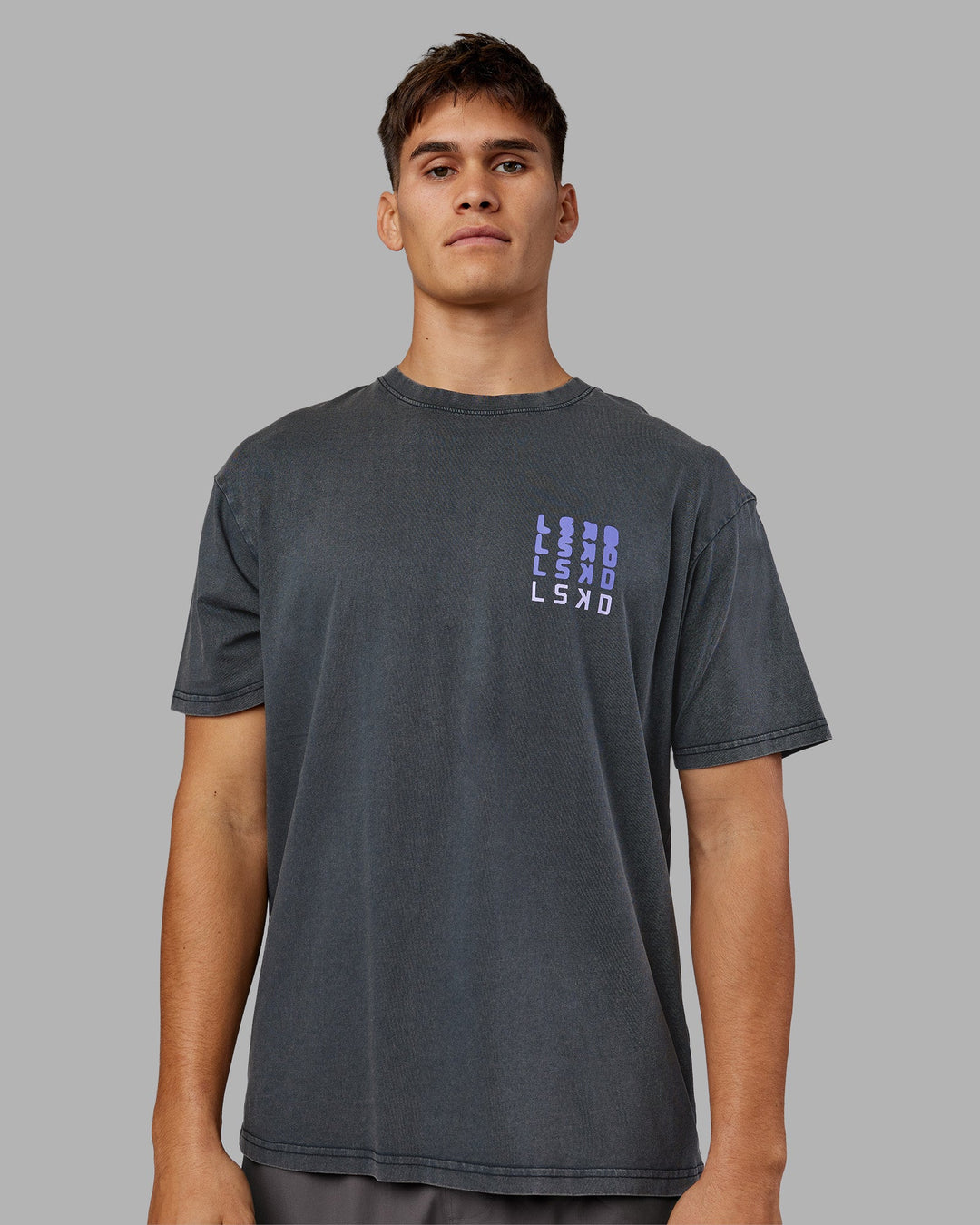 Man wearing Inferno Journey FLXCotton Oversized Tee - Black Washed-Violet Ray | Model:Jackson | Size:L