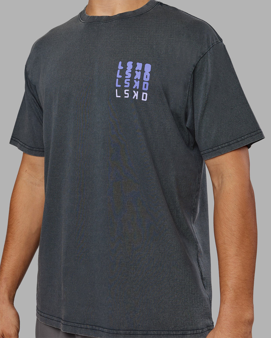 Man wearing Inferno Journey FLXCotton Oversized Tee - Black Washed-Violet Ray | Model:Jackson | Size:L