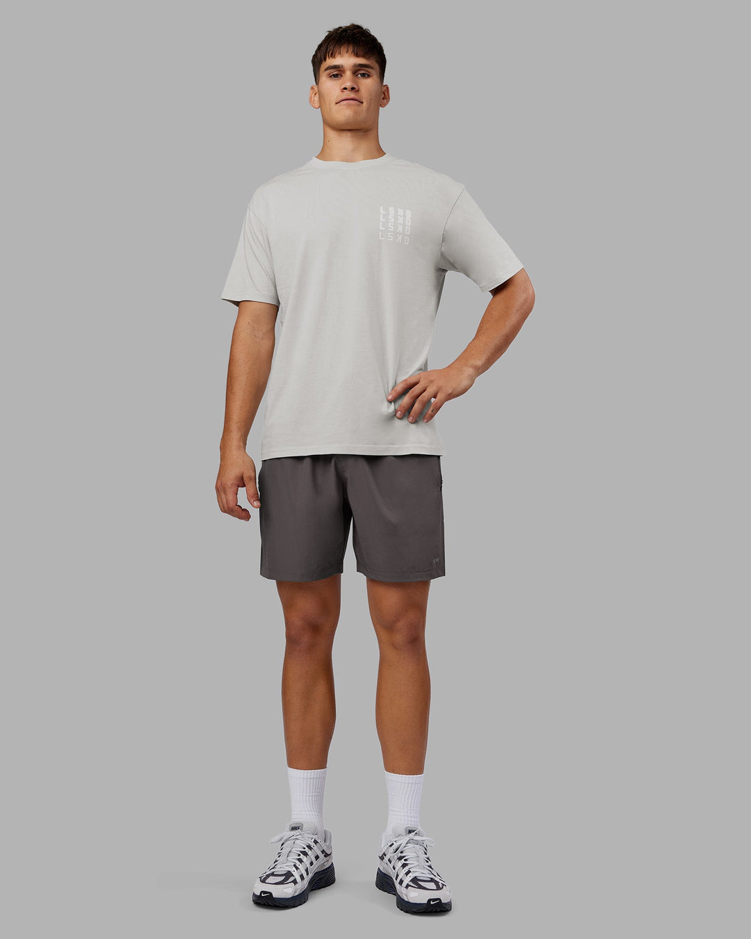 Man wearing Inferno Journey FLXCotton Oversized Tee - Digital Mist Washed-White | Model:Jackson | Size:L