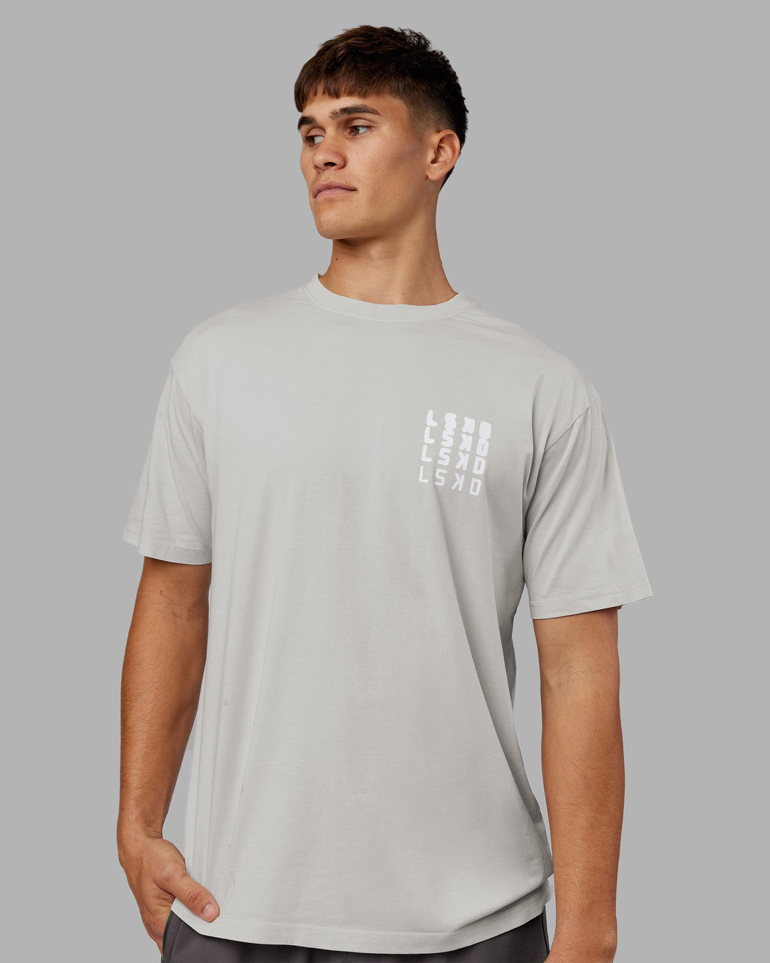 Man wearing Inferno Journey FLXCotton Oversized Tee - Digital Mist Washed-White | Model:Jackson | Size:L