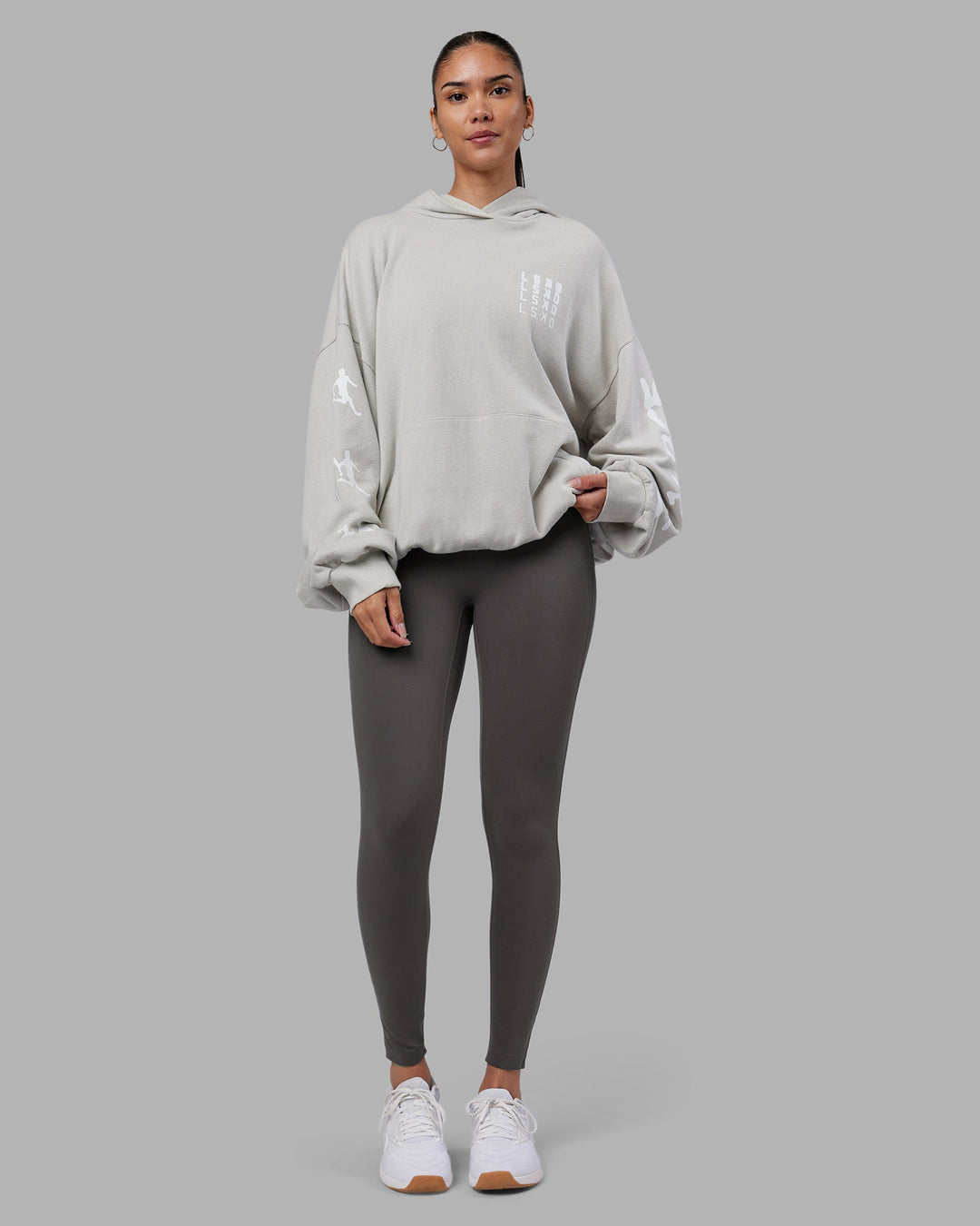 Woman wearing Journey Washed Unisex Oversize Hoodie - Digital Mist-White | Model:Rhiley | Size:L