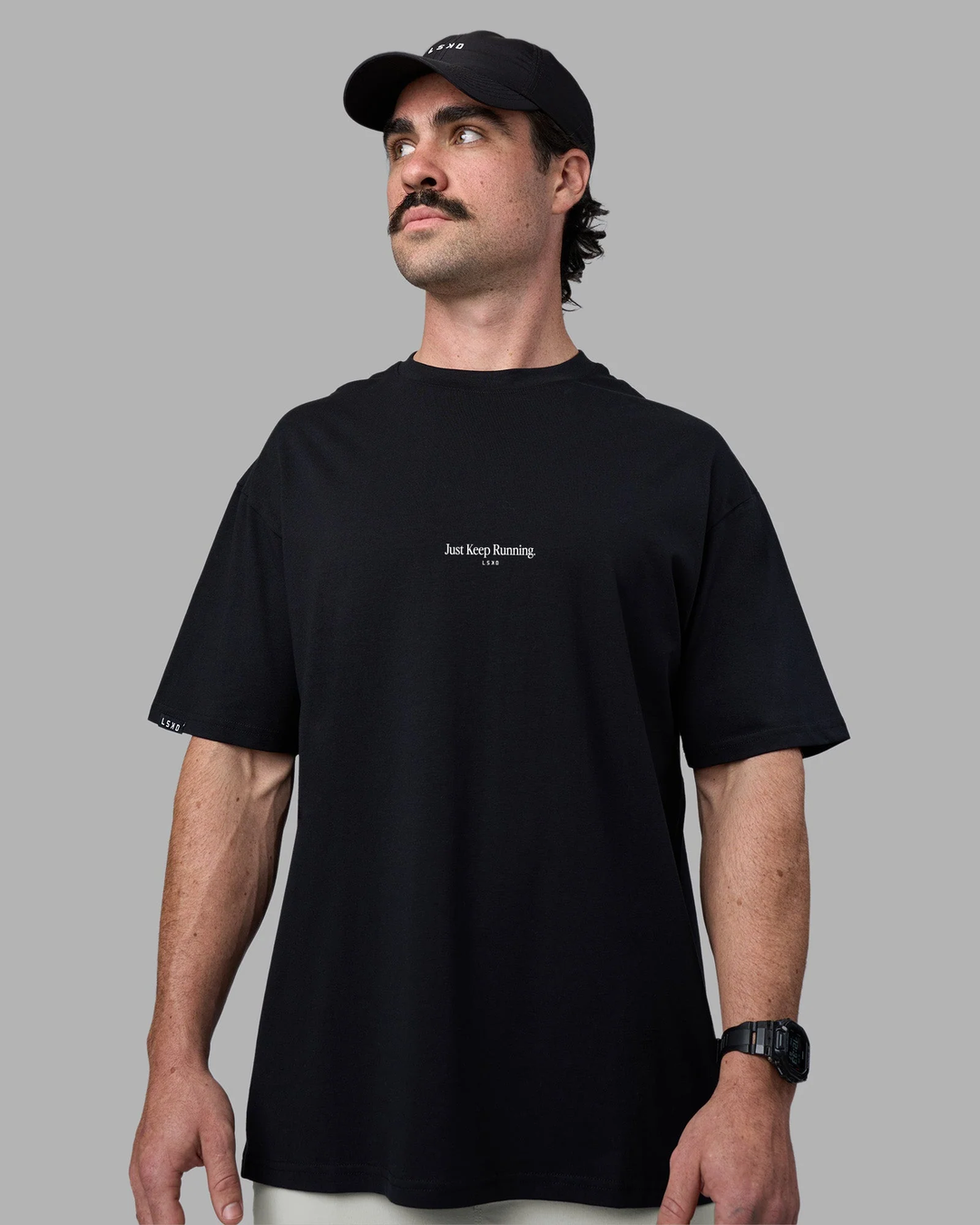 Man wearing Just Keep Running FLXCotton Oversized Tee - Black | Model:Adam | Size:L