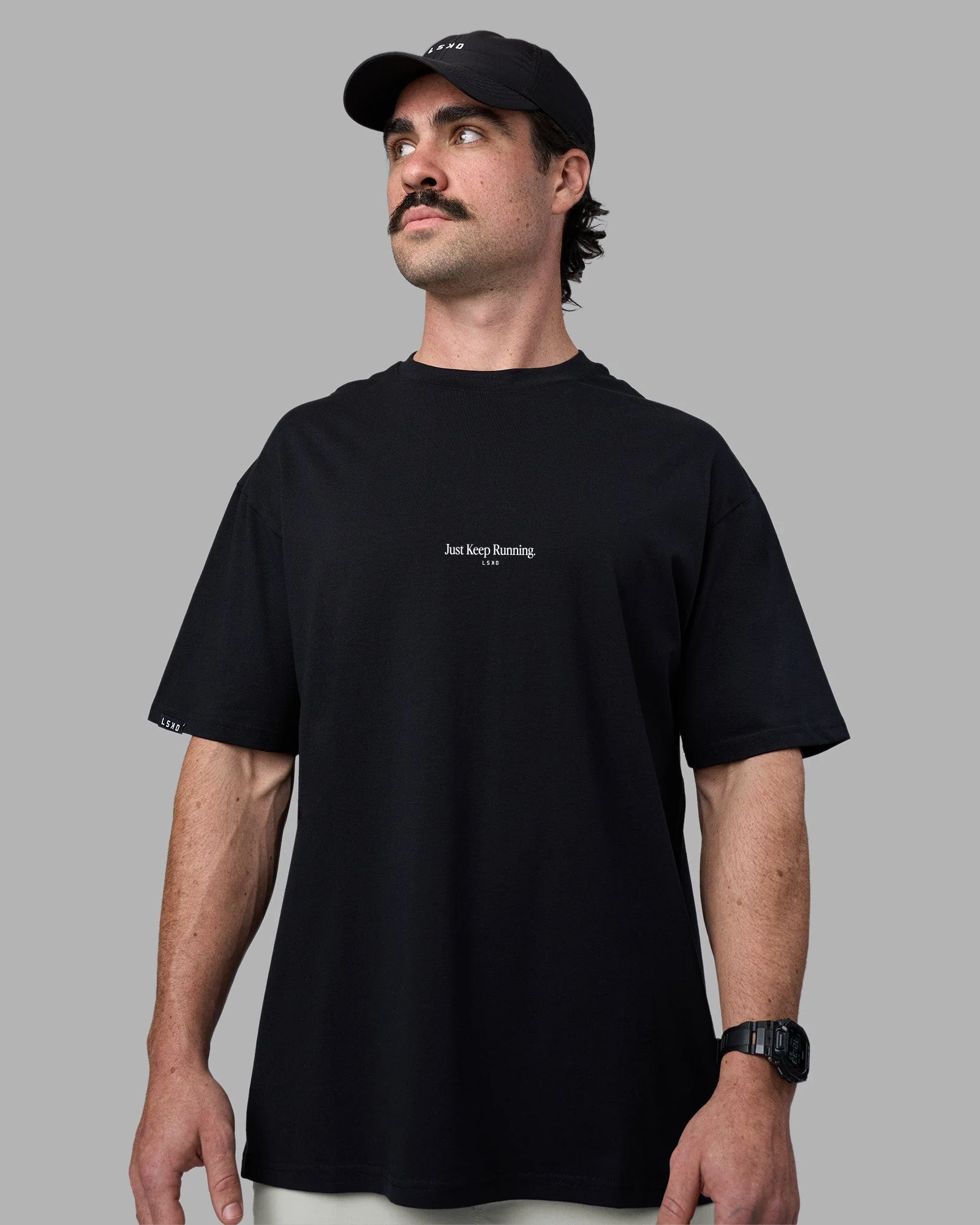 Man wearing Just Keep Running FLXCotton Oversized Tee - Black | Model:Adam | Size:L