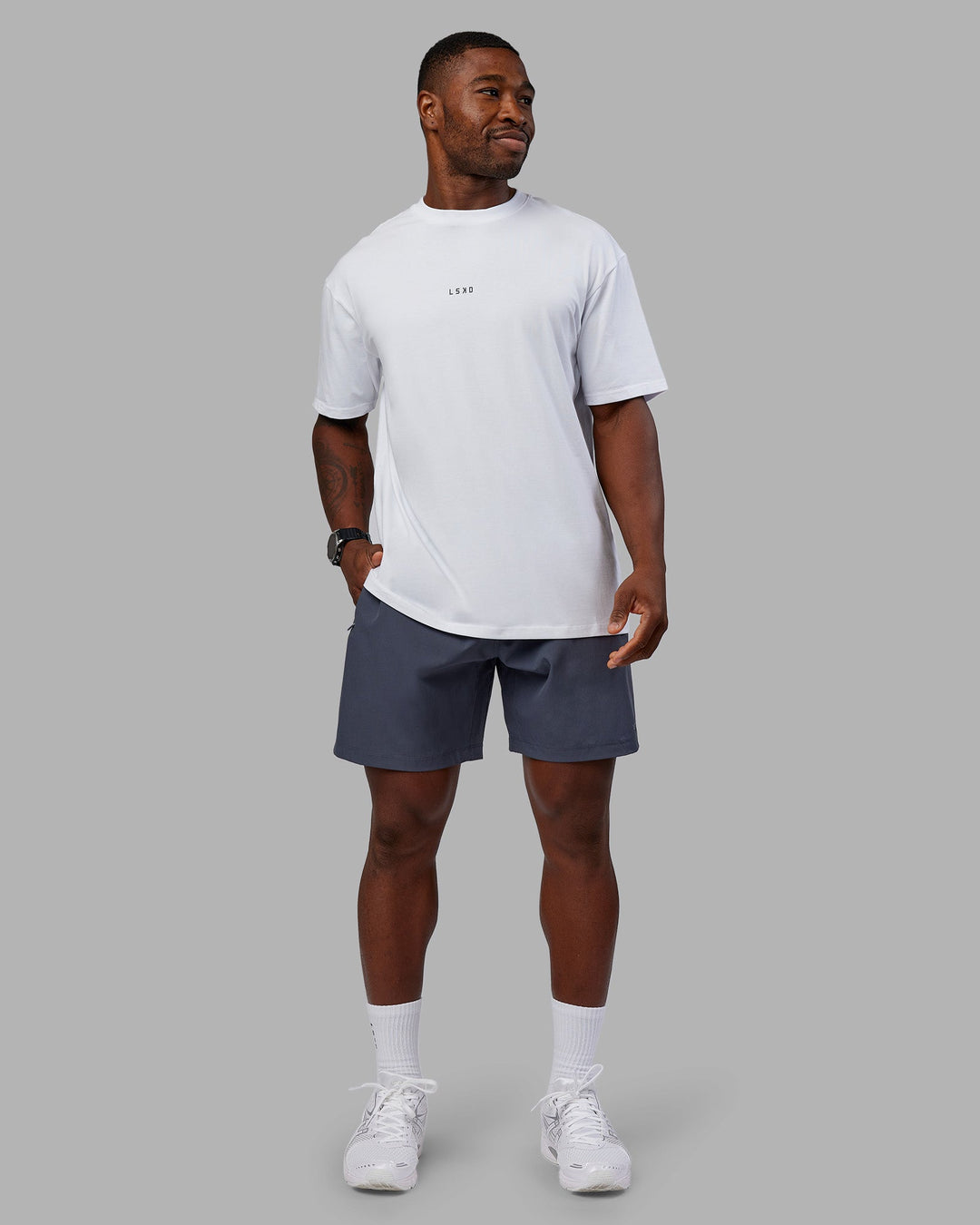 Man wearing Kettlebell FLXCotton Oversized Tee - White-Black | Model:Sam | Size:L