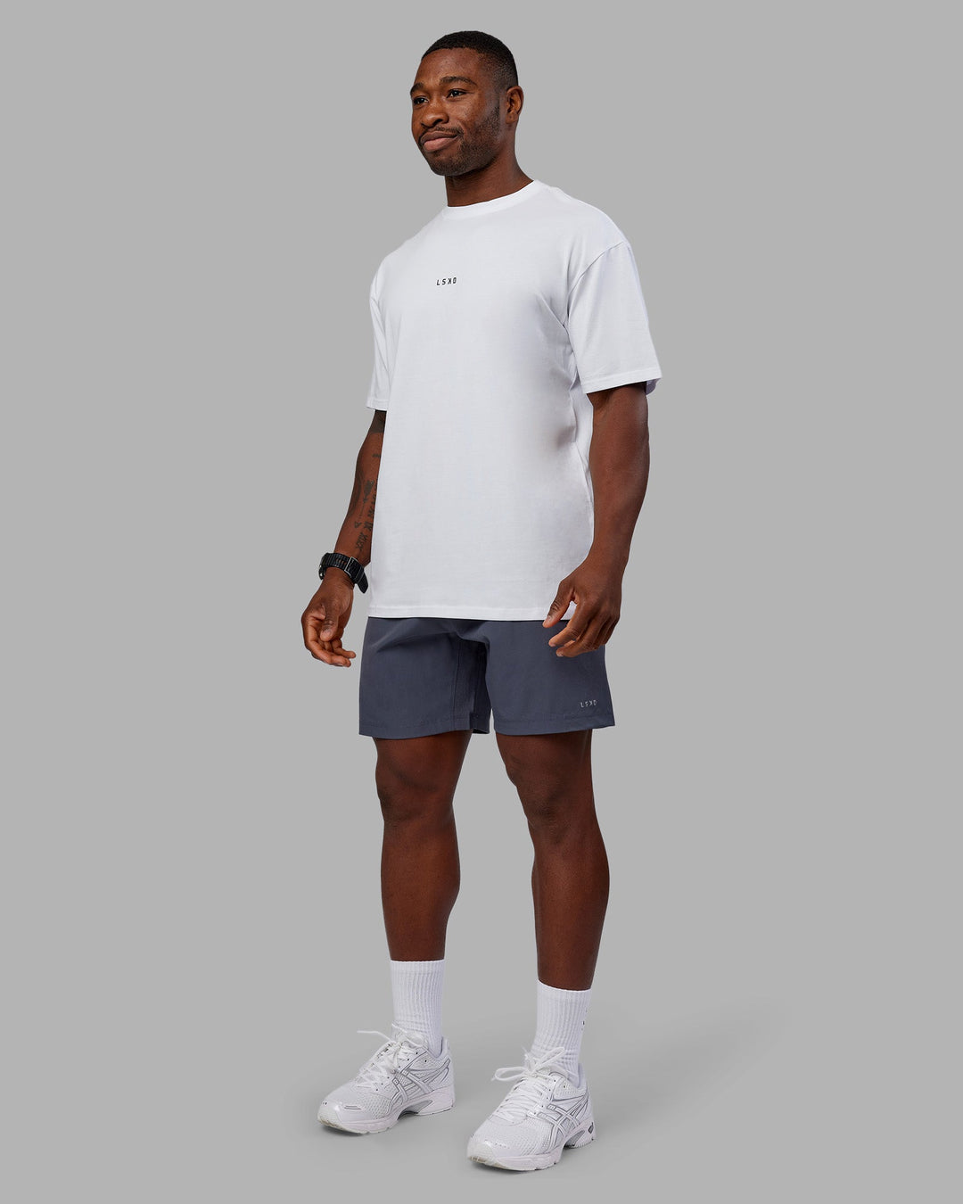 Man wearing Kettlebell FLXCotton Oversized Tee - White-Black | Model:Sam | Size:L