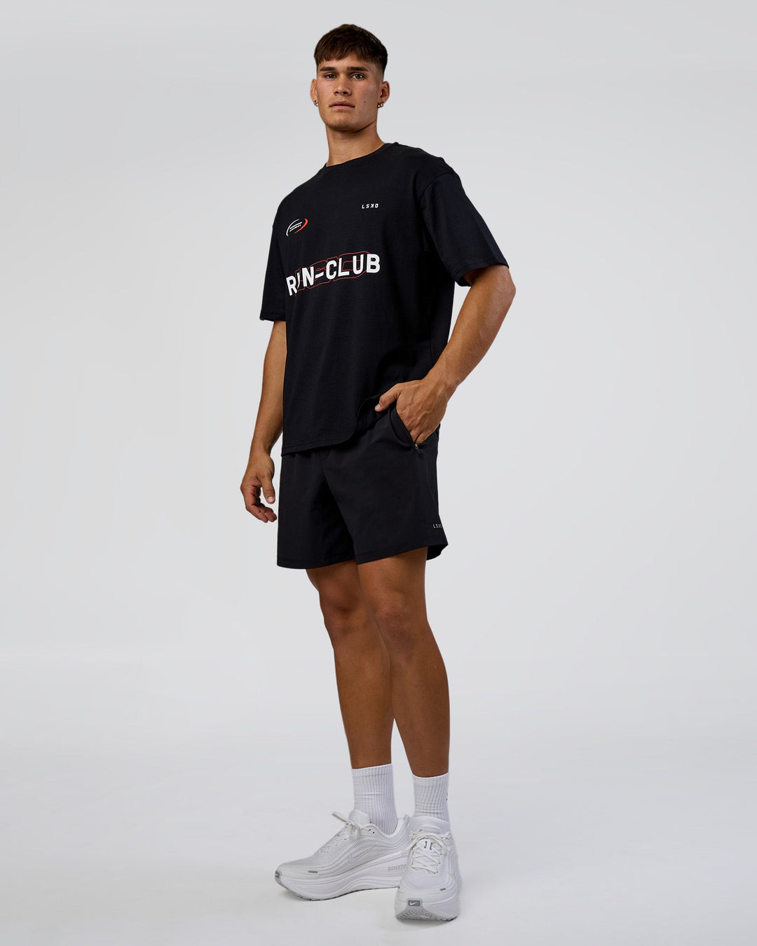 Man wearing LSKD Run Club FLXCotton Oversized Tee - Black-White | Model:Jackson | Size:L