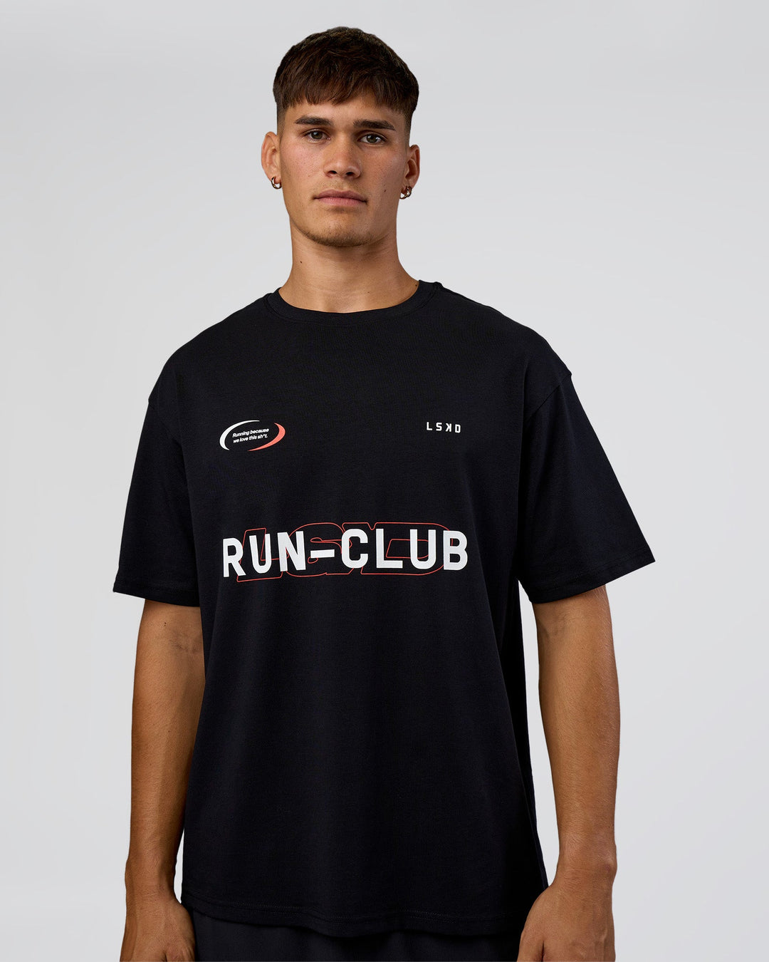 Man wearing LSKD Run Club FLXCotton Oversized Tee - Black-White | Model:Jackson | Size:L
