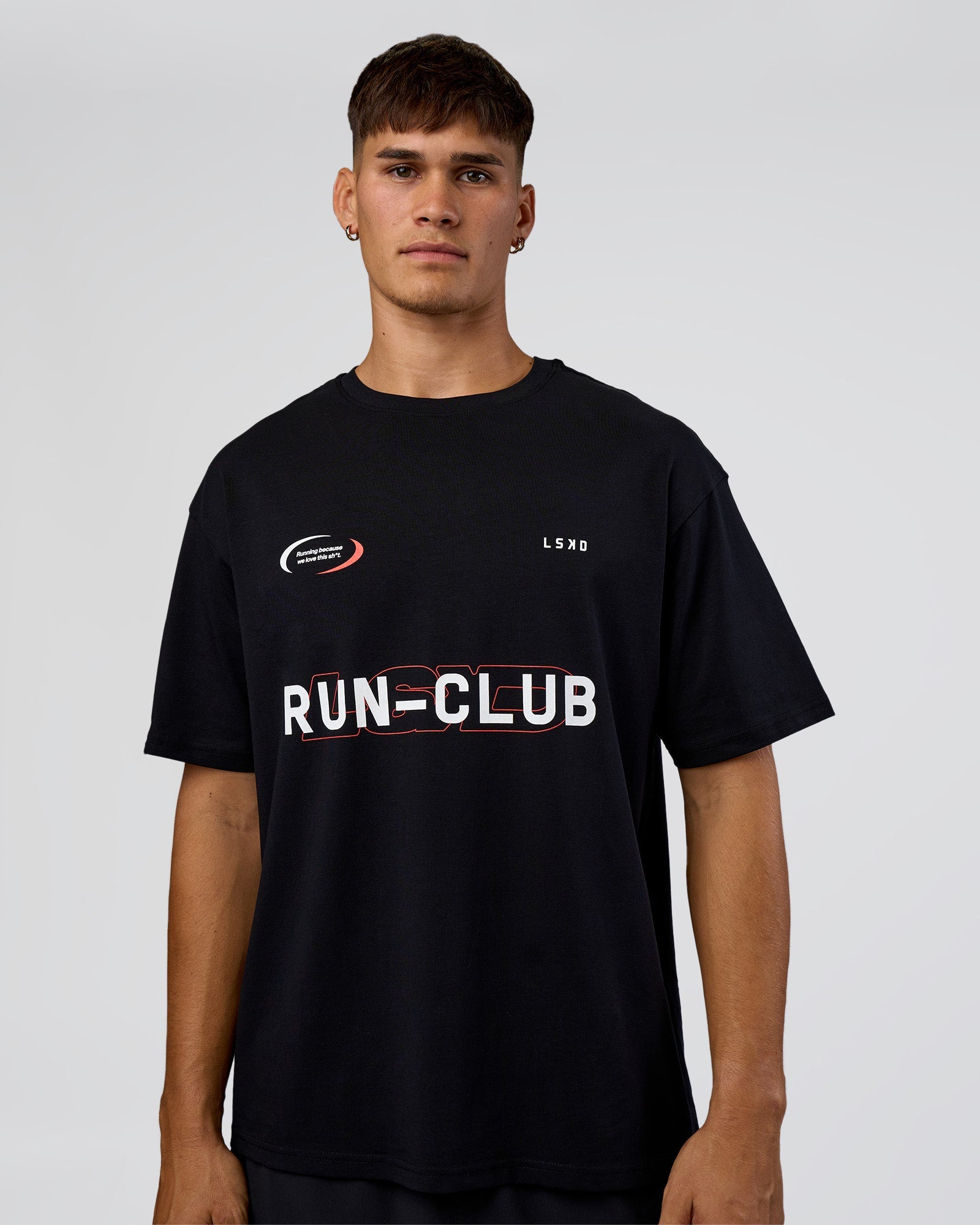 Man wearing LSKD Run Club FLXCotton Oversized Tee - Black-White | Model:Jackson | Size:L