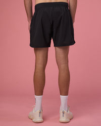 Man wearing Lift 6" Short - Black-Ultra Pink | Model:Brandon | Size:L