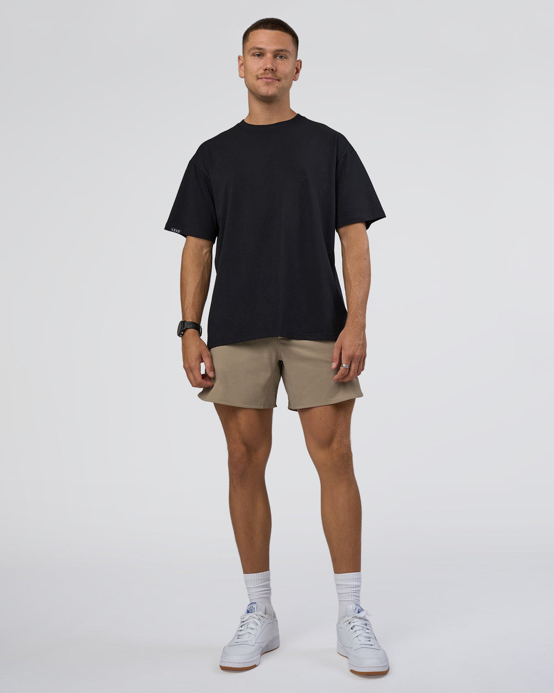 Man wearing Lifting Club FLXCotton Tee Oversize - Black-Black | Model:Nikola | Size:L