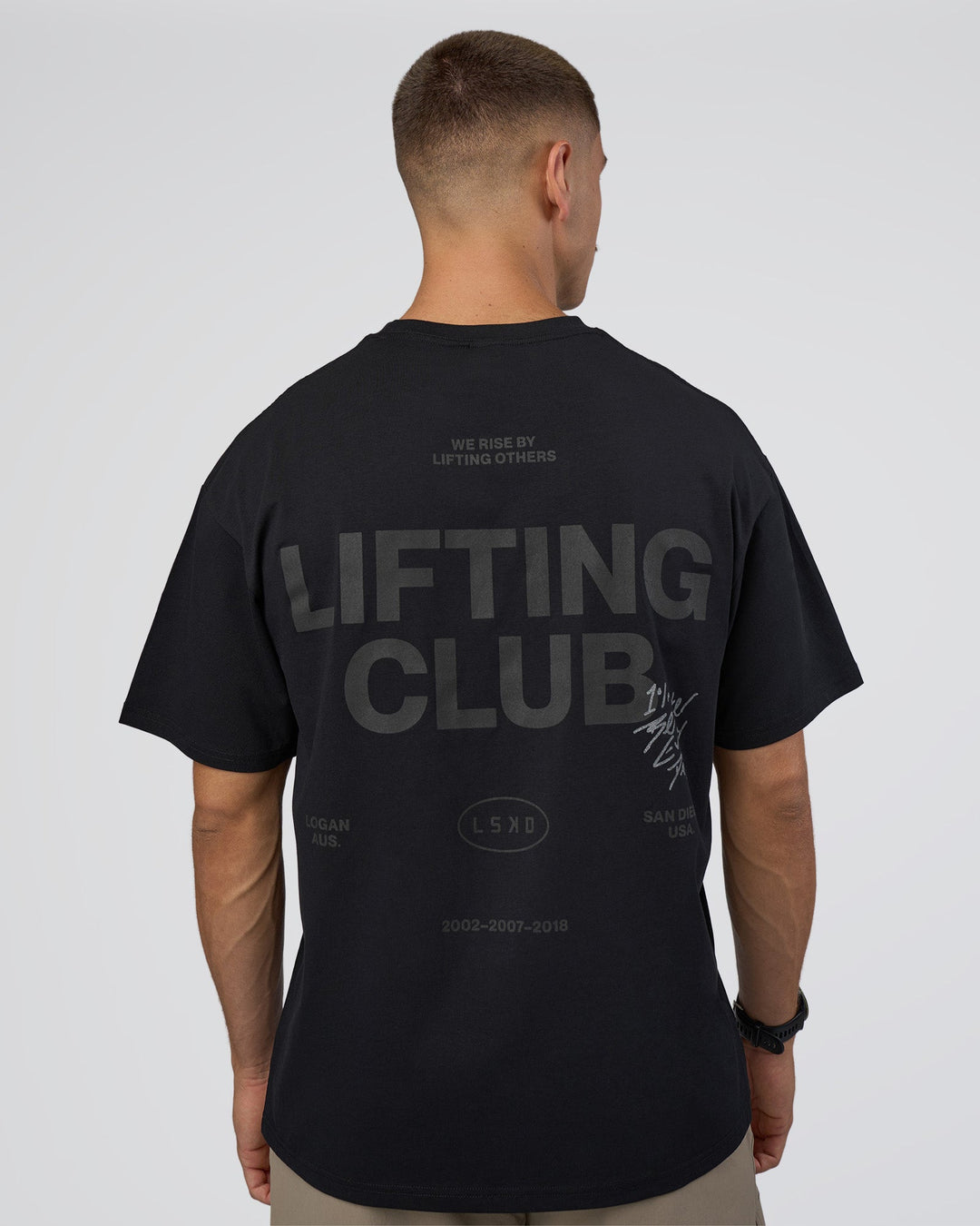 Man wearing Lifting Club FLXCotton Tee Oversize - Black-Black | Model:Nikola | Size:L