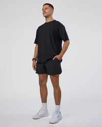 Man wearing Lifting Club FLXCotton Tee Oversize - Black-White-Red | Model:Nikola | Size:L