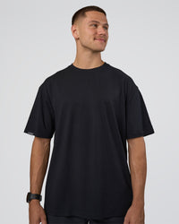 Man wearing Lifting Club FLXCotton Tee Oversize - Black-White-Red | Model:Nikola | Size:L