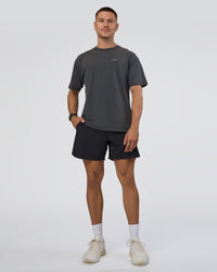 Man wearing Lifting FLXCotton Oversized Tee - Black Washed-Flame | Model:Nikola | Size:L