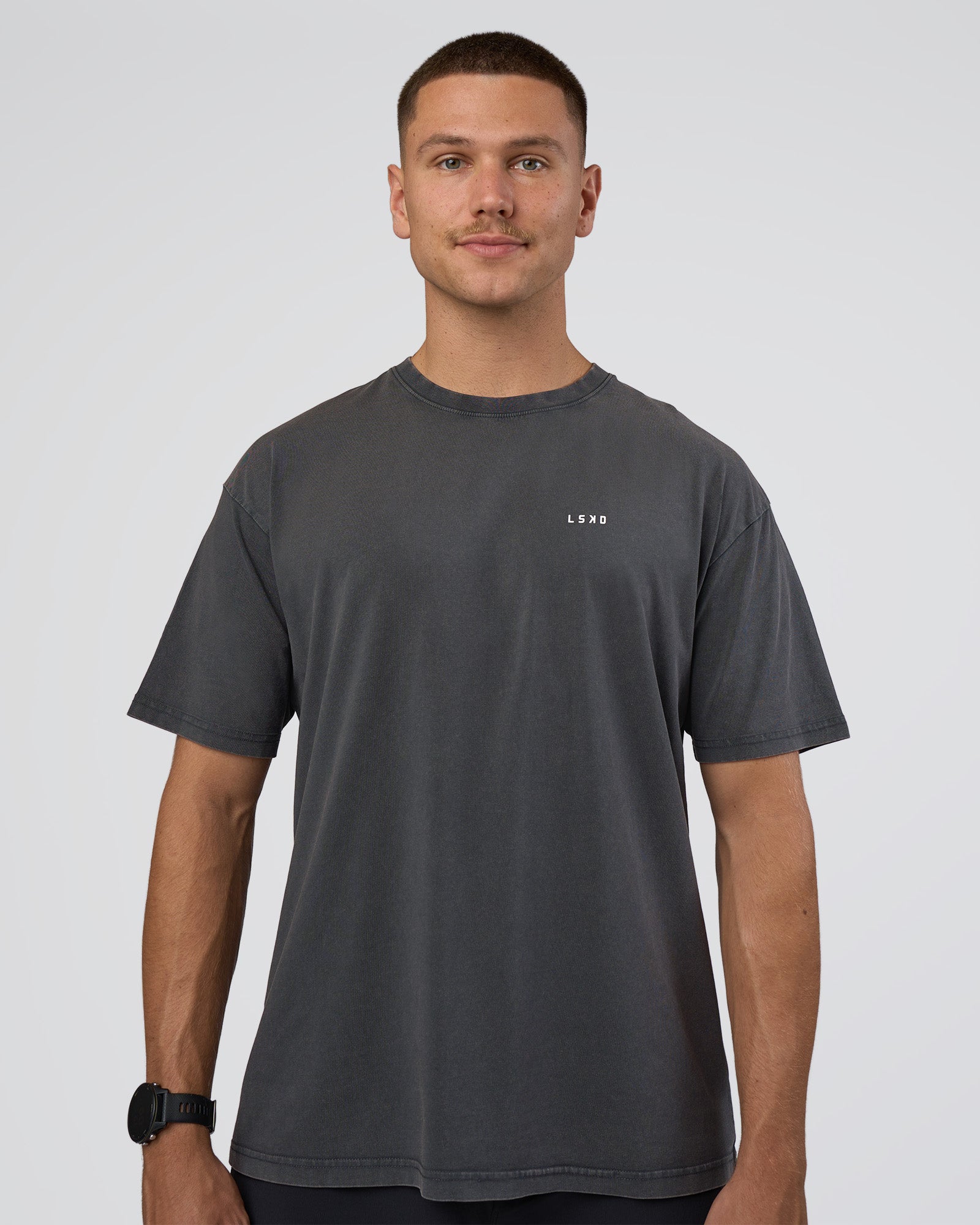 Man wearing Lifting FLXCotton Oversized Tee - Black Washed-Flame | Model:Nikola | Size:L