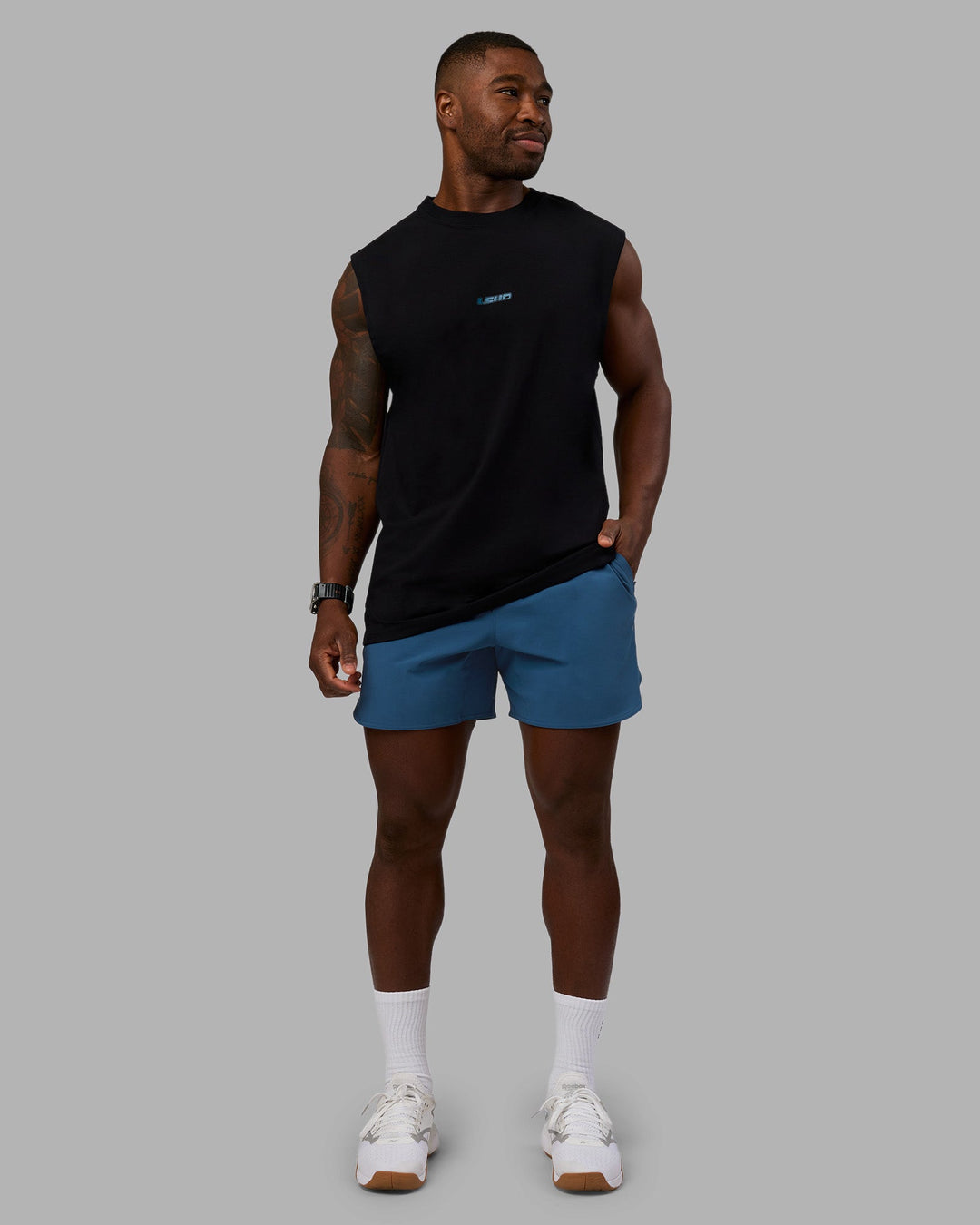 Man wearing Lifting Heavyweight FLXCotton Tank - Black-Blue Coral | Model:Sam | Size:L