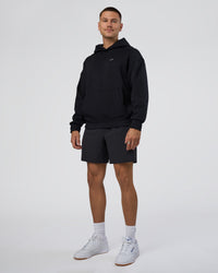 Man wearing Lifting Unisex Oversized Hoodie - Black-Flame| Model:Nikola | Size:L