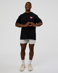 Man wearing Love the Journey FLXCotton Oversized Tee - Black-Flame | Model:Sam | Size:L