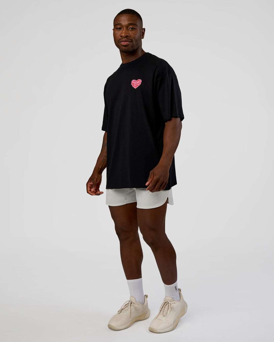 Man wearing Love the Journey FLXCotton Oversized Tee - Black-Flame | Model:Sam | Size:L