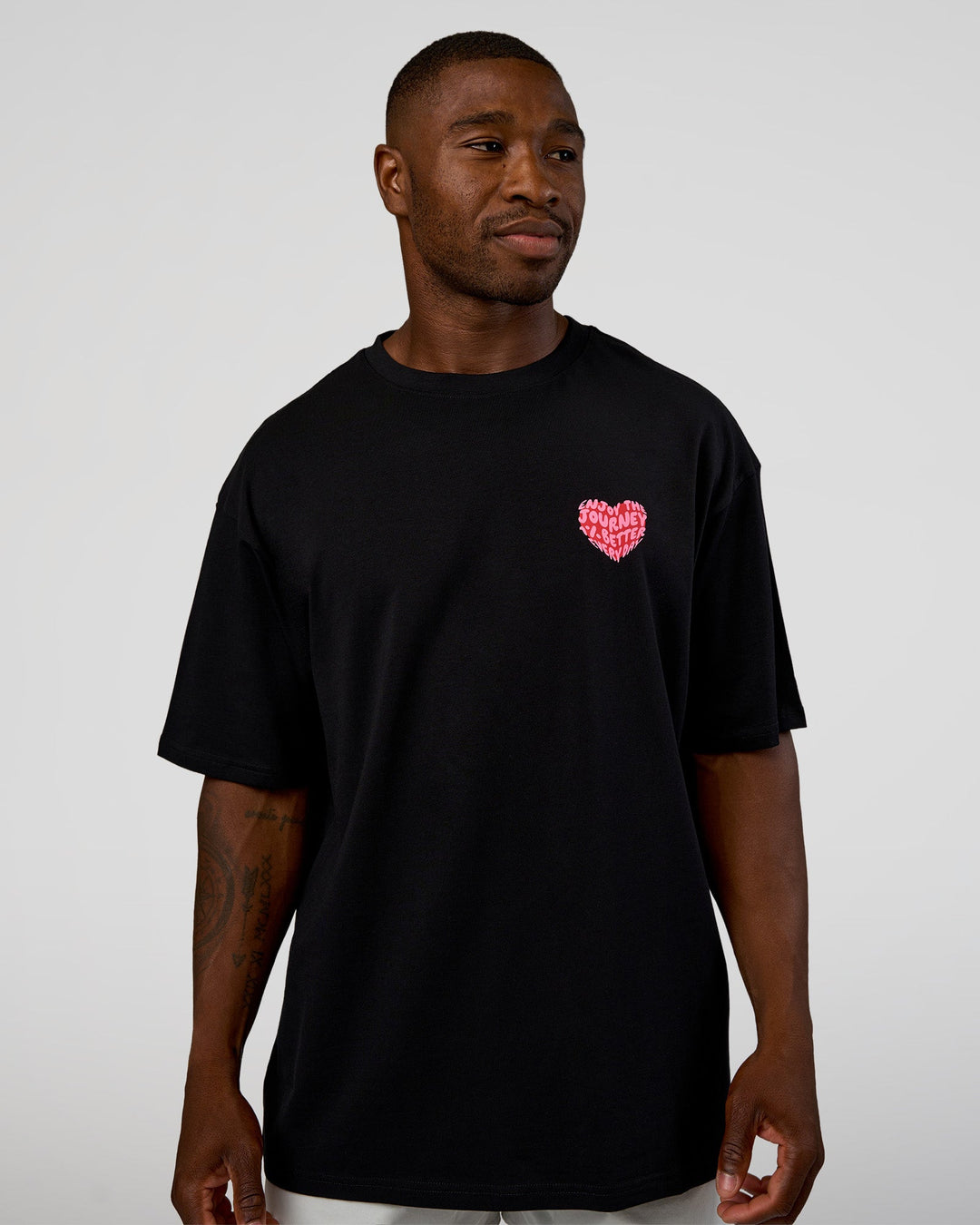 Man wearing Love the Journey FLXCotton Oversized Tee - Black-Flame | Model:Sam | Size:L