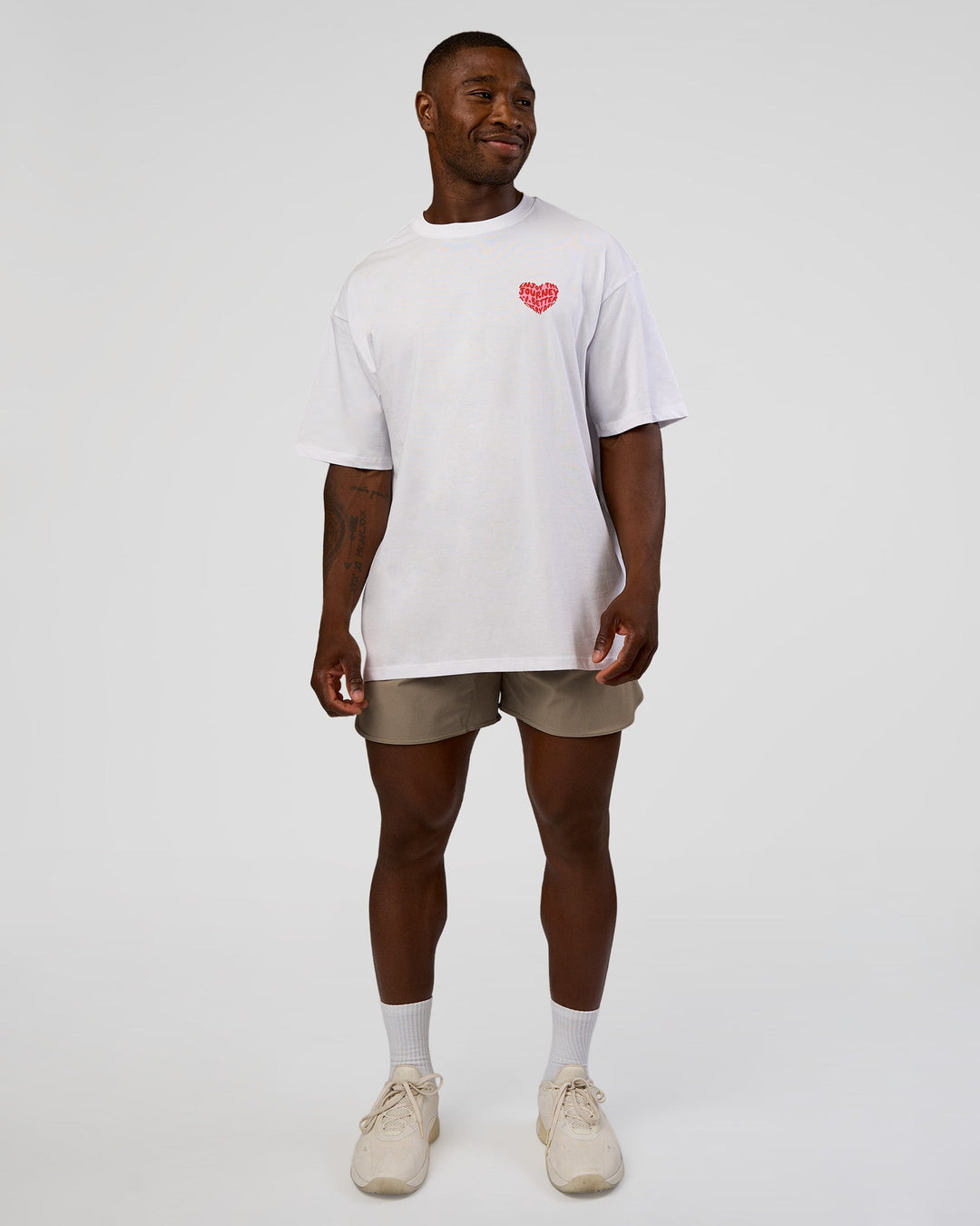 Man wearing Love the Journey FLXCotton Oversized Tee - White-Candy Pink | Model:Sam | Size:L