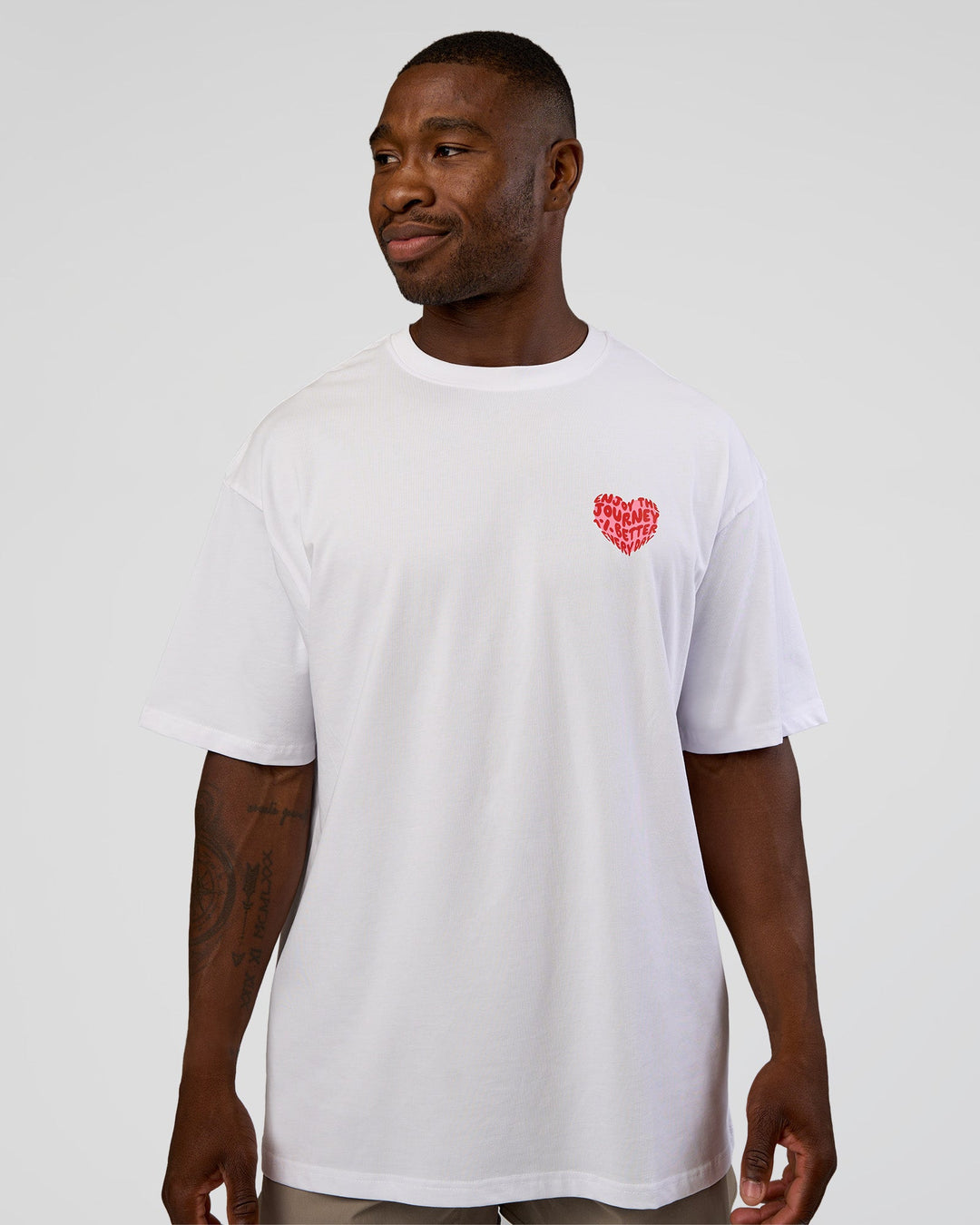 Man wearing Love the Journey FLXCotton Oversized Tee - White-Candy Pink | Model:Sam | Size:L
