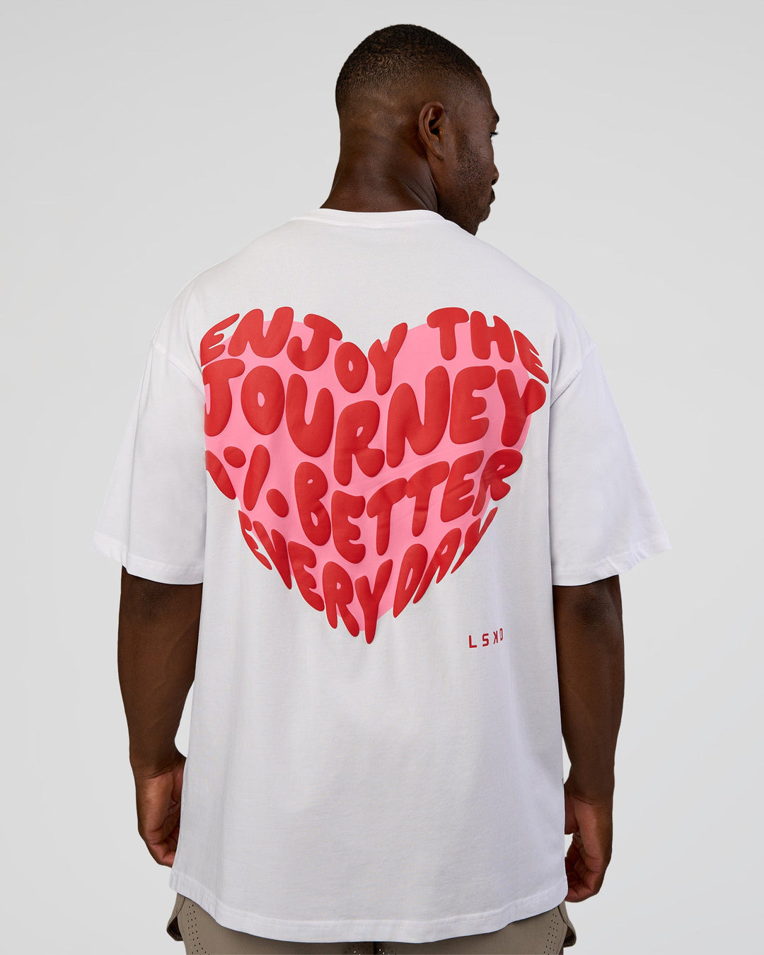 Man wearing Love the Journey FLXCotton Oversized Tee - White-Candy Pink | Model:Sam | Size:L