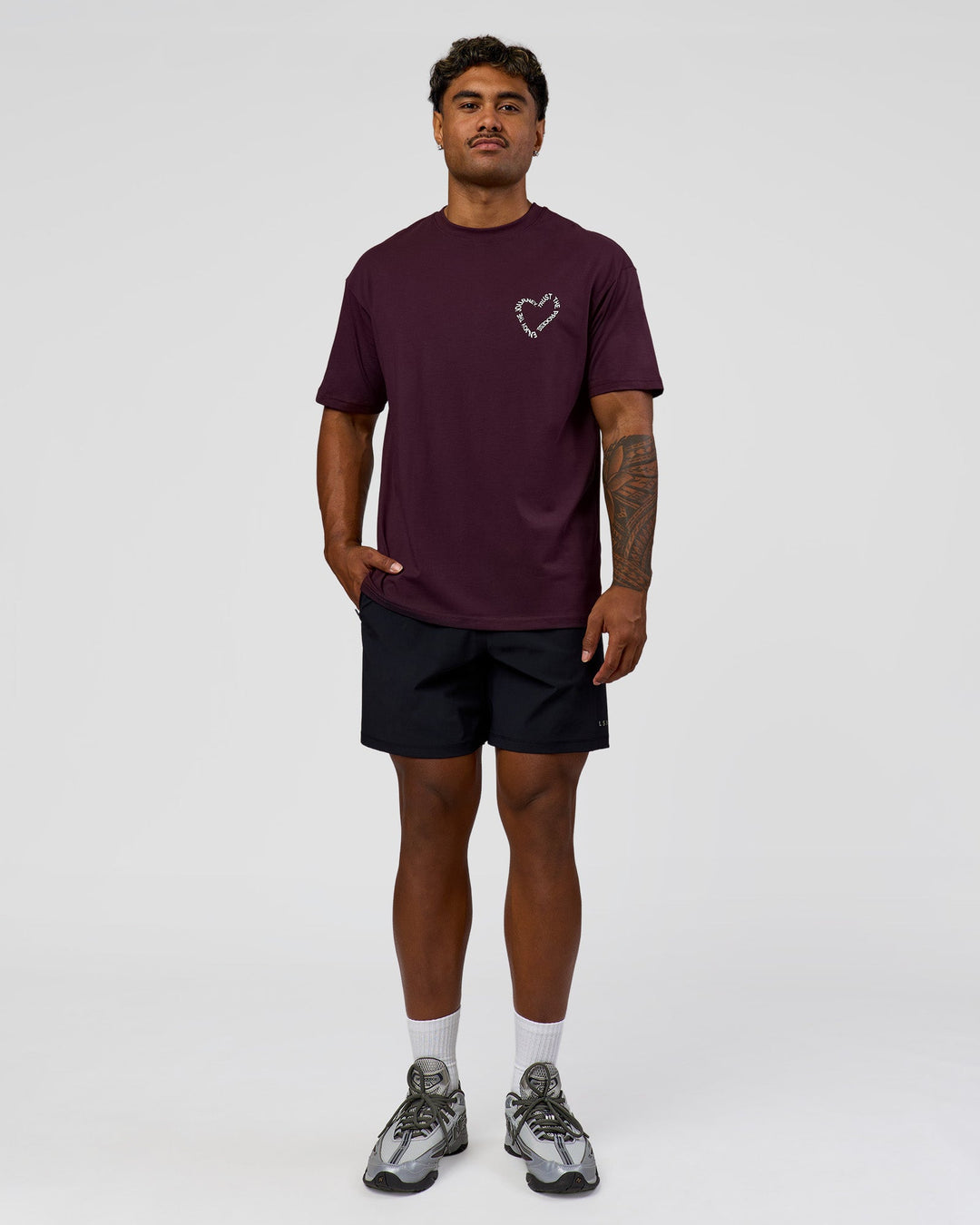 Man wearing Love The Process FLXCotton Oversize Tee - Midnight Plum-White | Model:Xav | Size:L