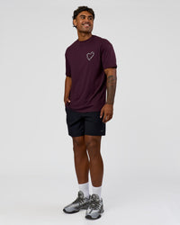 Man wearing Love The Process FLXCotton Oversize Tee - Midnight Plum-White | Model:Xav | Size:L