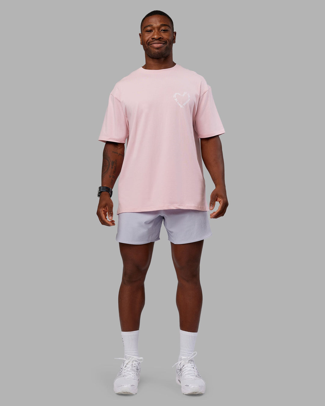 Man wearing Love The Process FLXCotton Oversize Tee - Petal Pink-White | Model:Sam | Size:L