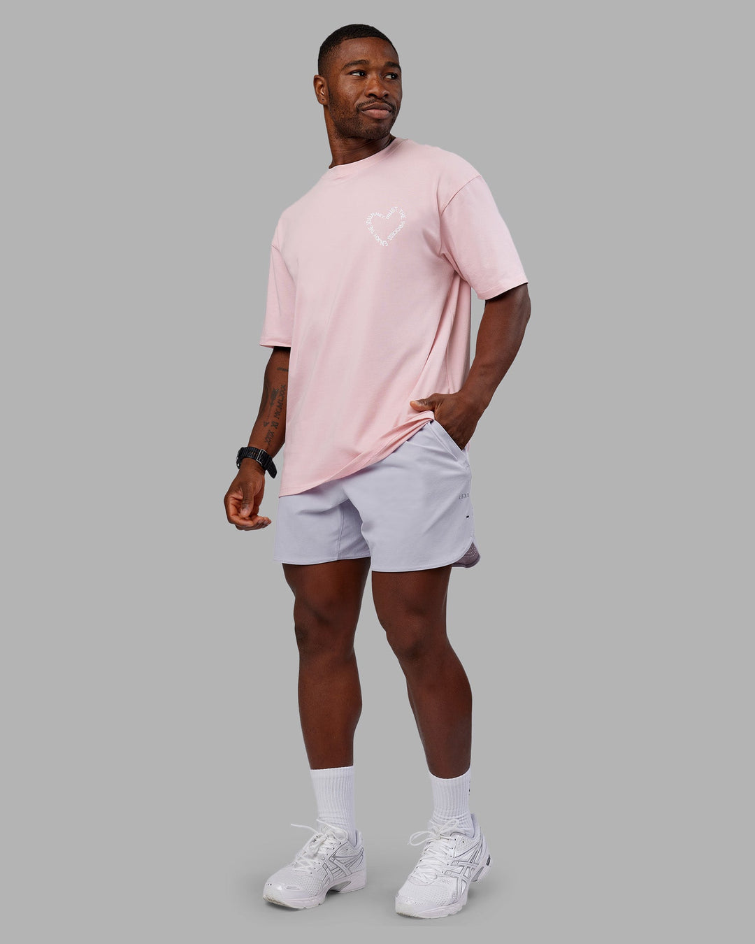 Man wearing Love The Process FLXCotton Oversize Tee - Petal Pink-White | Model:Sam | Size:L