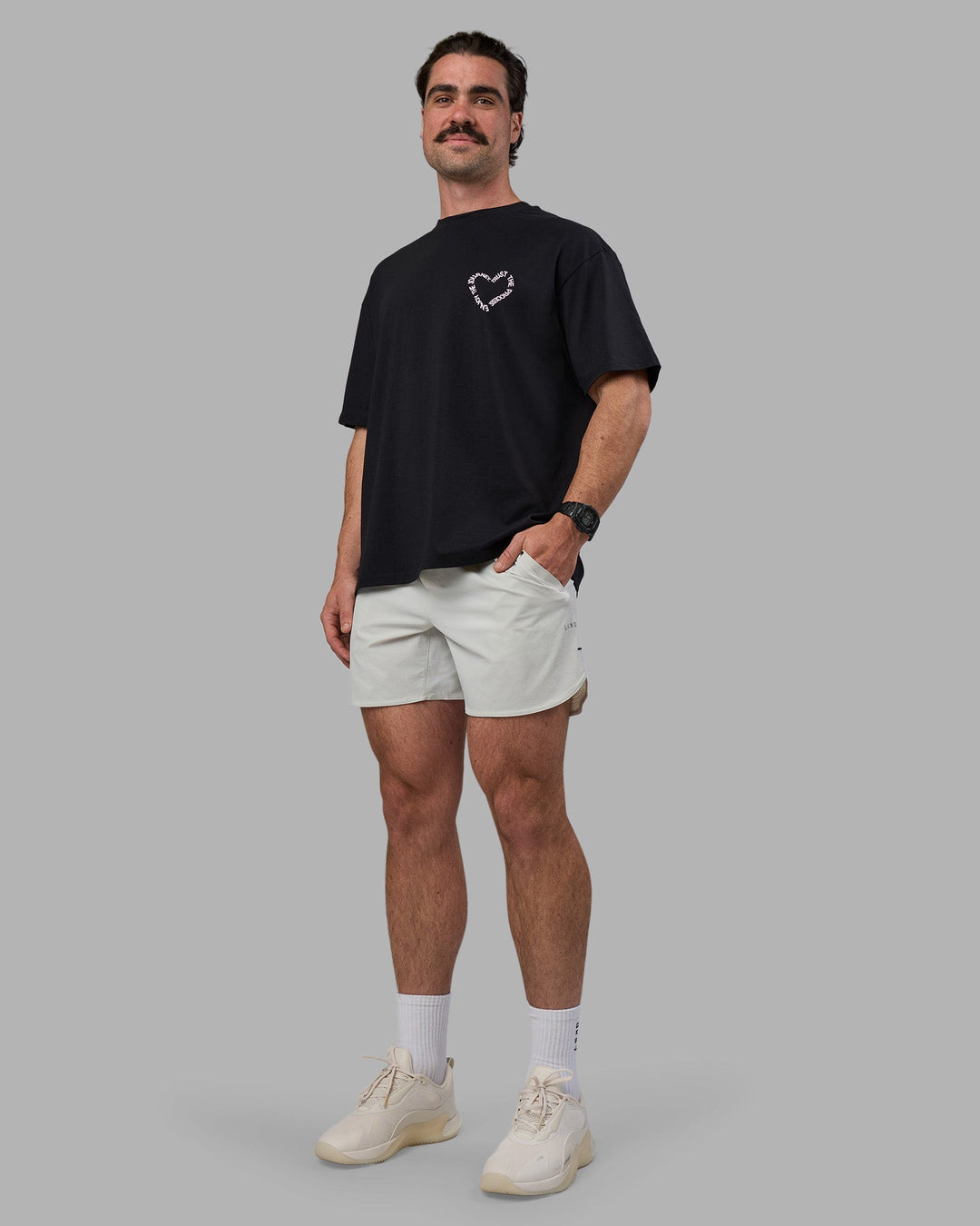 Man wearing Love The Process FLXCotton Oversize Tee - Black-Bubblegum | Model:Adam | Size:L