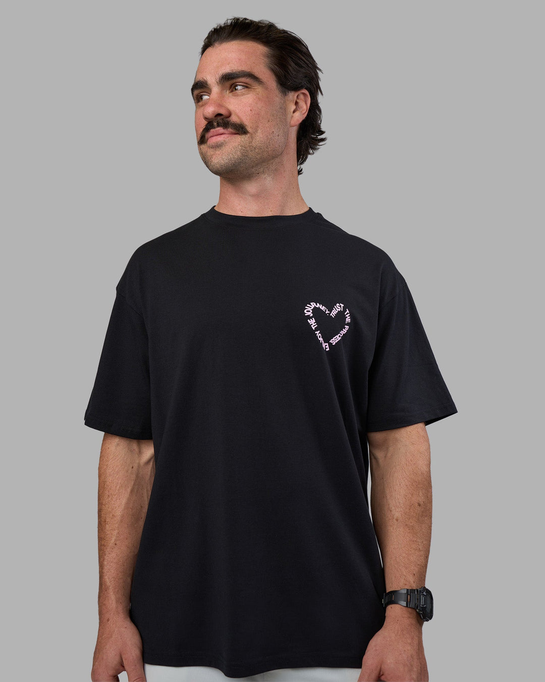 Man wearing Love The Process FLXCotton Oversize Tee - Black-Bubblegum | Model:Adam | Size:L