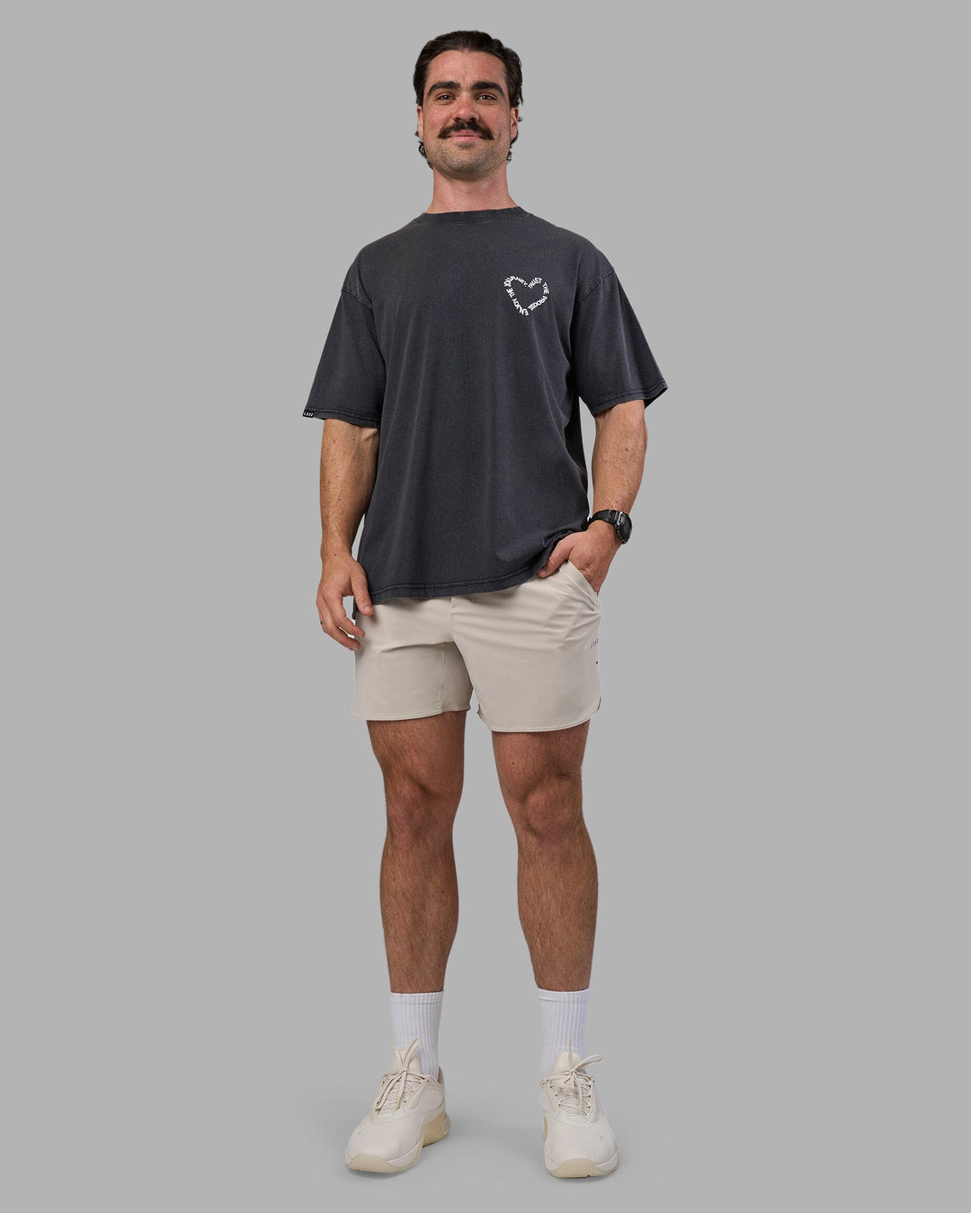 Man wearing Love The Process FLXCotton Oversize Tee - Black Washed-White | Model:Adam | Size:L