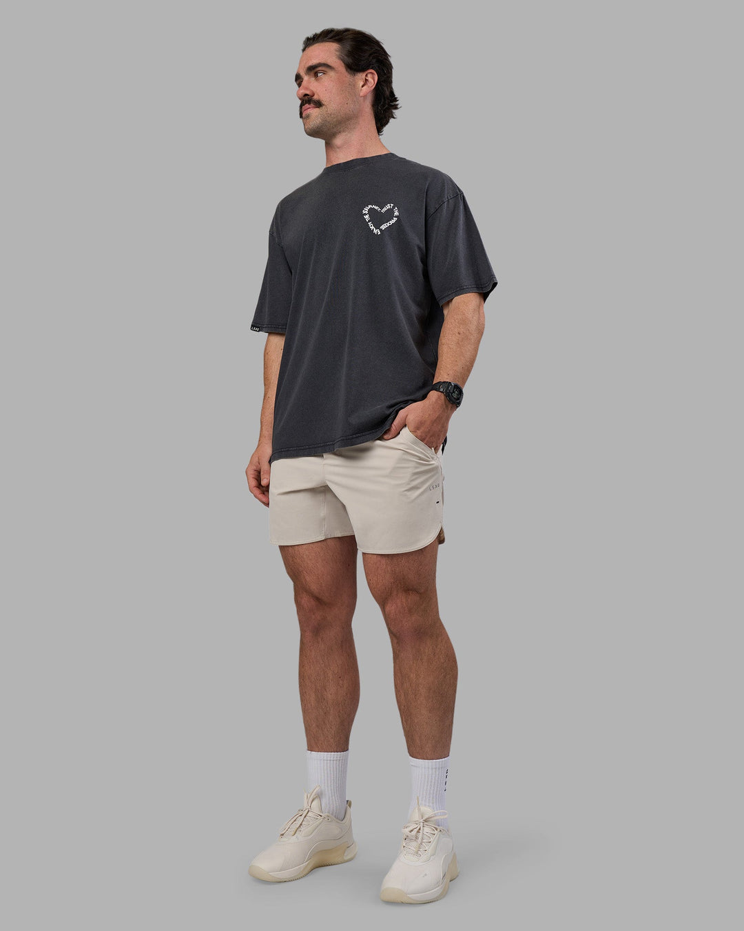 Man wearing Love The Process FLXCotton Oversize Tee - Black Washed-White | Model:Adam | Size:L