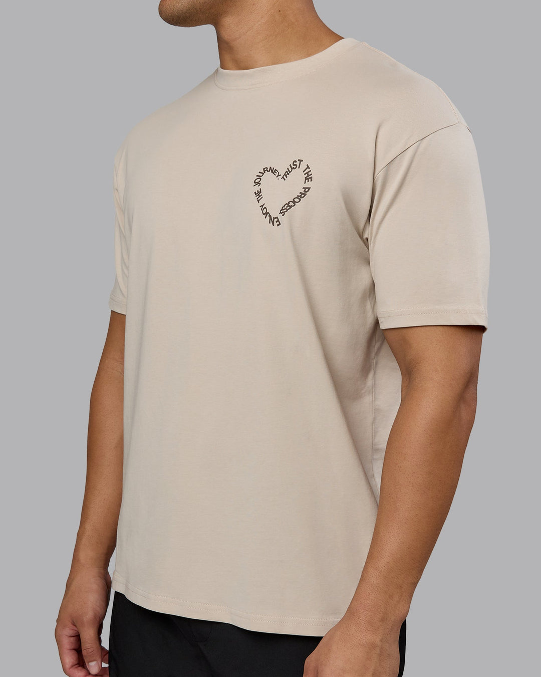 Man wearing Love The Process FLXCotton Oversize Tee - Shale Beige-Choc | Model:Kaelyb | Size:L