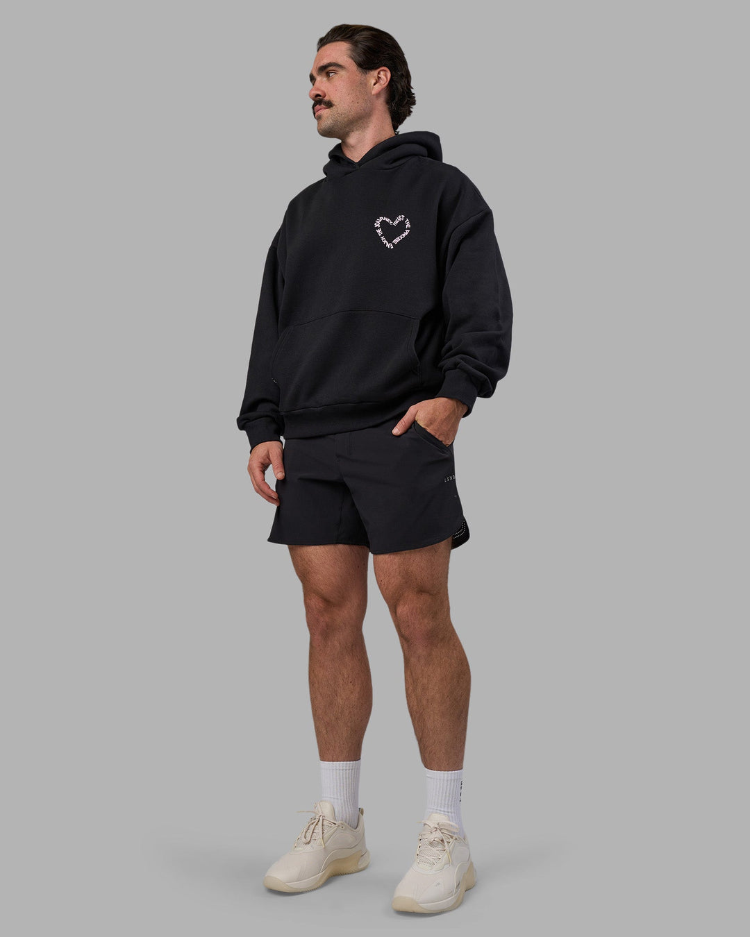 Man wearing Unisex Love The Process Oversize Hoodie - Black-Bubble Gum | Model:Adam | Size:L