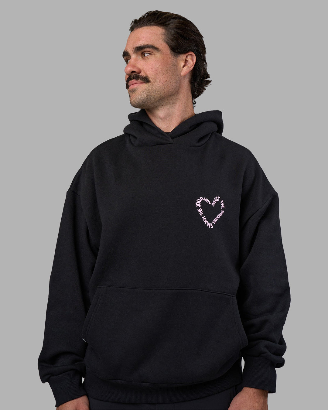 Man wearing Unisex Love The Process Oversize Hoodie - Black-Bubble Gum | Model:Adam | Size:L