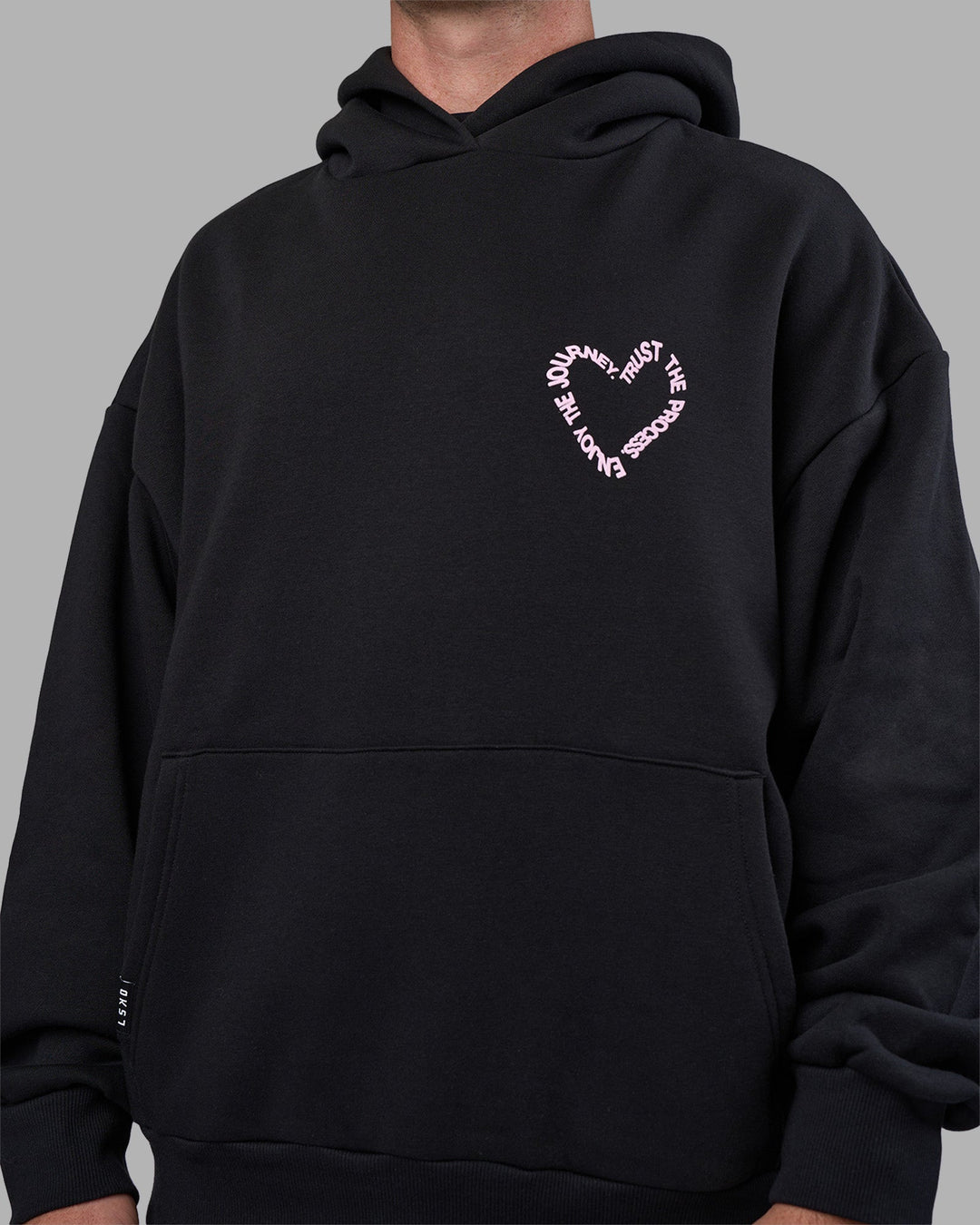 Man wearing Unisex Love The Process Oversize Hoodie - Black-Bubble Gum | Model:Adam | Size:L