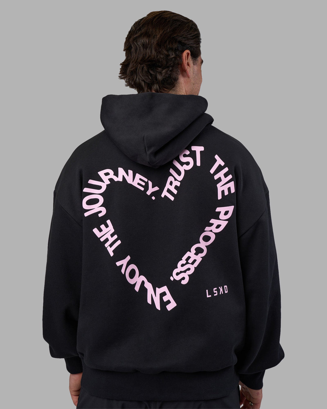 Man wearing Unisex Love The Process Oversize Hoodie - Black-Bubble Gum | Model:Adam | Size:L