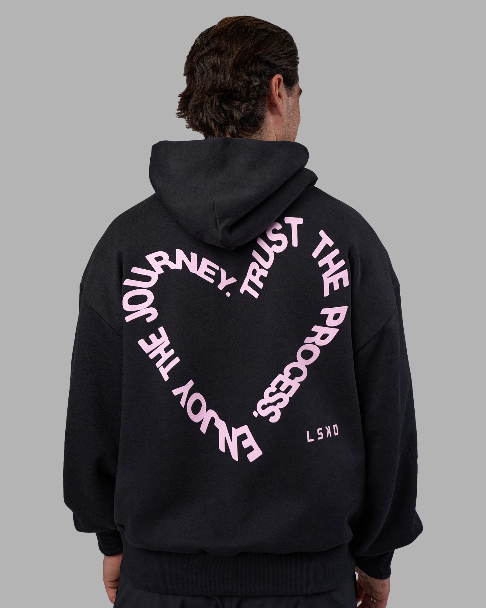 Man wearing Unisex Love The Process Oversize Hoodie - Black-Bubble Gum | Model:Adam | Size:L