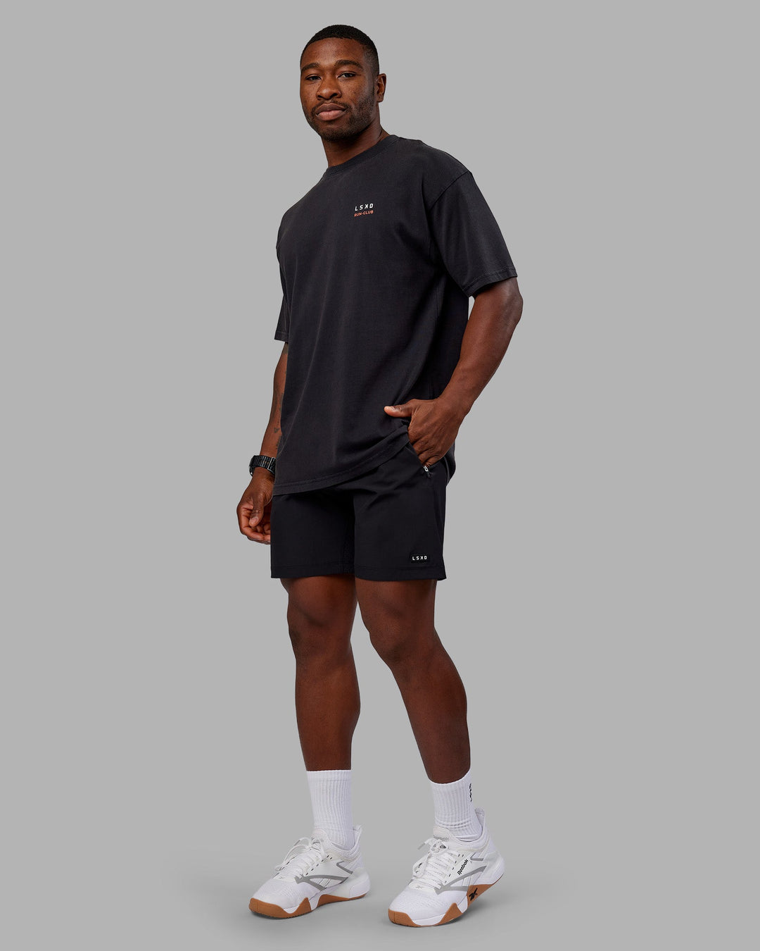 Man wearing Love this S**t Washed Heavyweight Oversized Tee - Washed Black-Ultra Orange | Model:Sam | Size:L