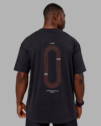 Man wearing Love this S**t Washed Heavyweight Oversized Tee - Washed Black-Ultra Orange | Model:Sam | Size:L